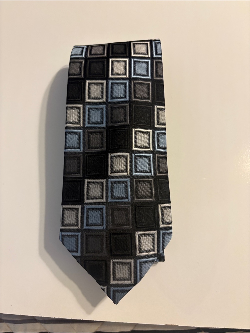 Croft and Barrow tie. Colors blue, silver, grey, and black.